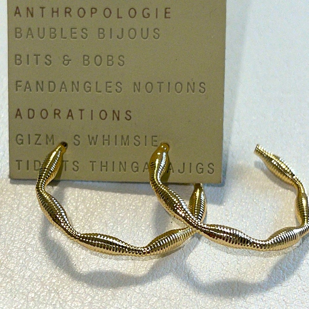 NWT- anthropology gold hoops Pierced earrings. 14 karat gold plated. 1.25”